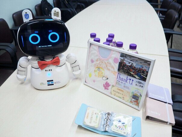 The display of the “Loving Baby”  alongside student-designed outfits